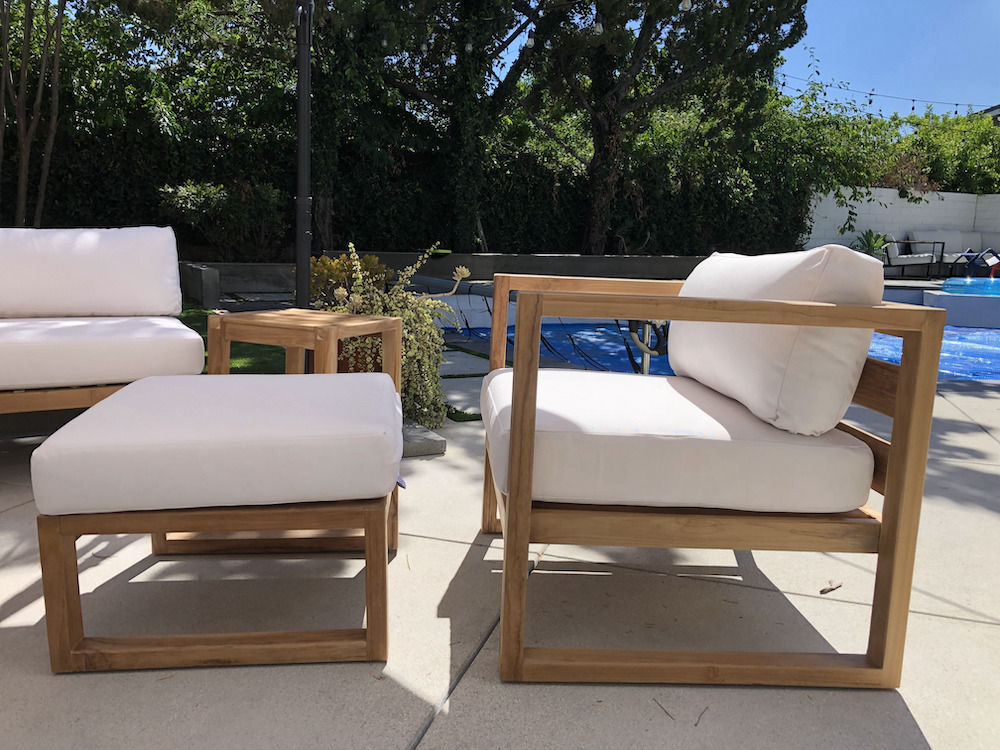 Teak Outdoor Patio Furniture with white cushions on outdoor patio by Willow Creek Designs in Los Angeles, California
