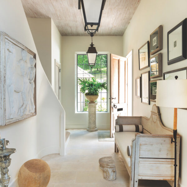 Dubuisson Limestone in home entry way foyer with pendant lighting and artwork