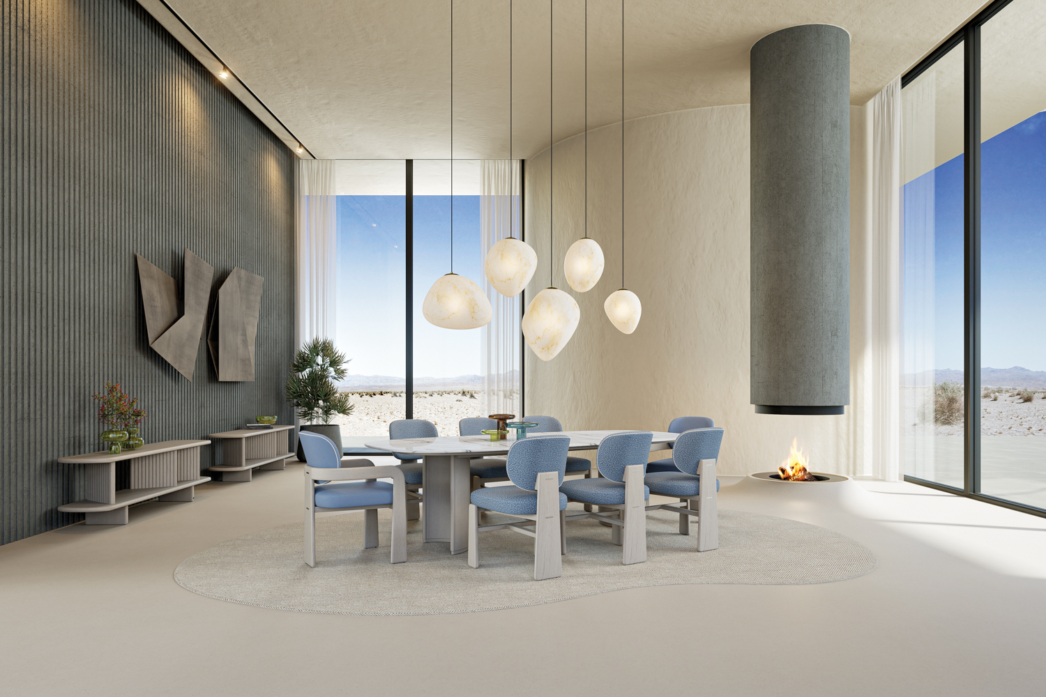Adriana Hoyos furniture collection including oblong dining table, blue chairs and low-hanging sculptural pendants