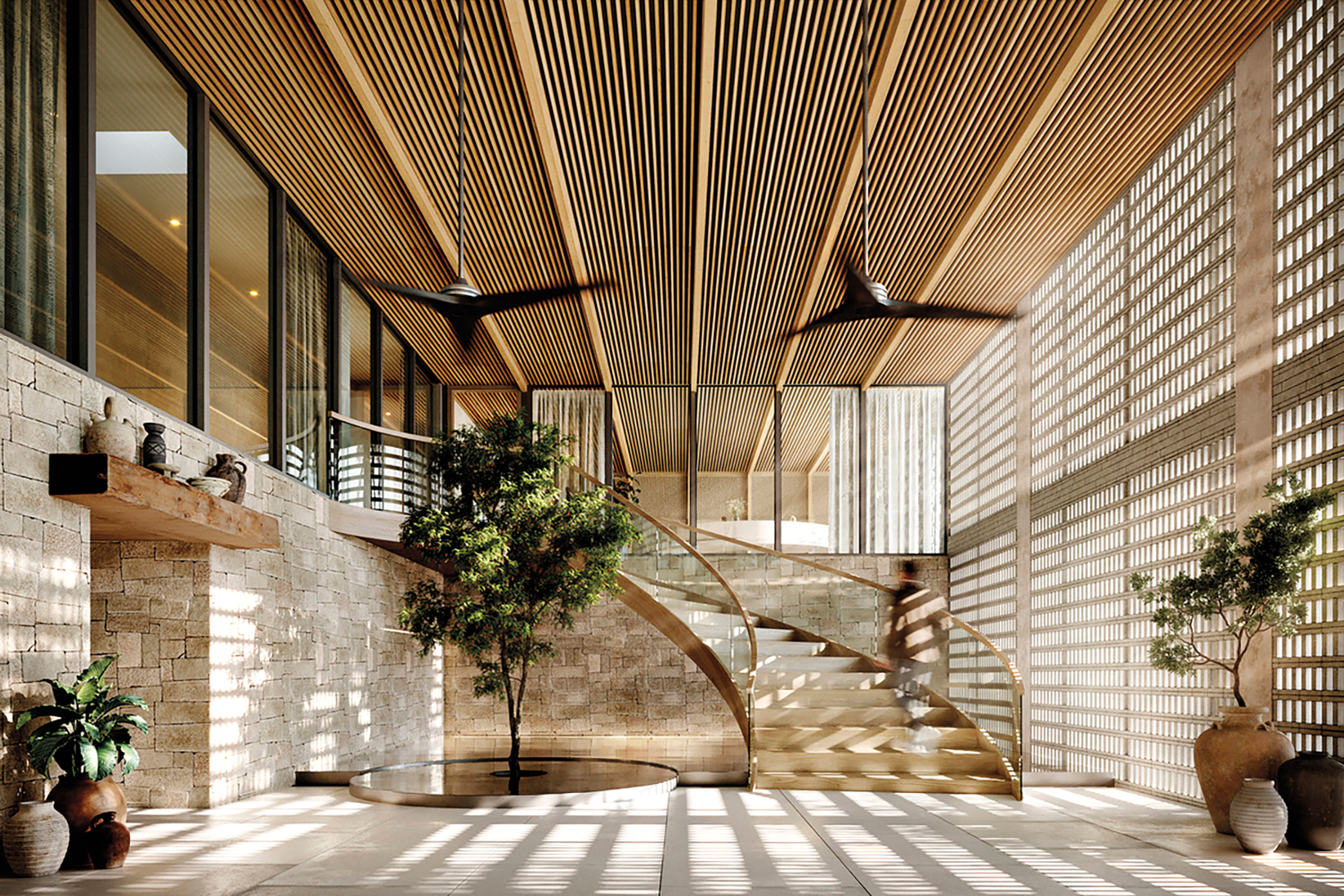 Earth-toned lobby with slated-wood ceiling, stacked stone walls and a central curved staircase