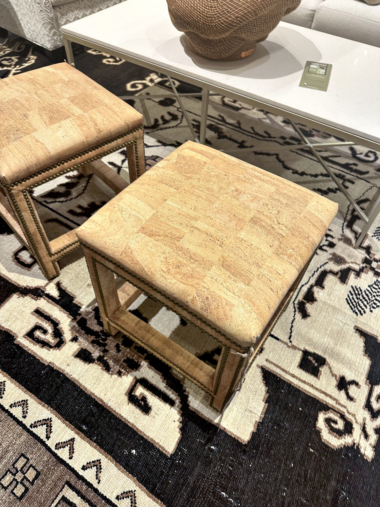 cork-covered stools on top of geometric rug