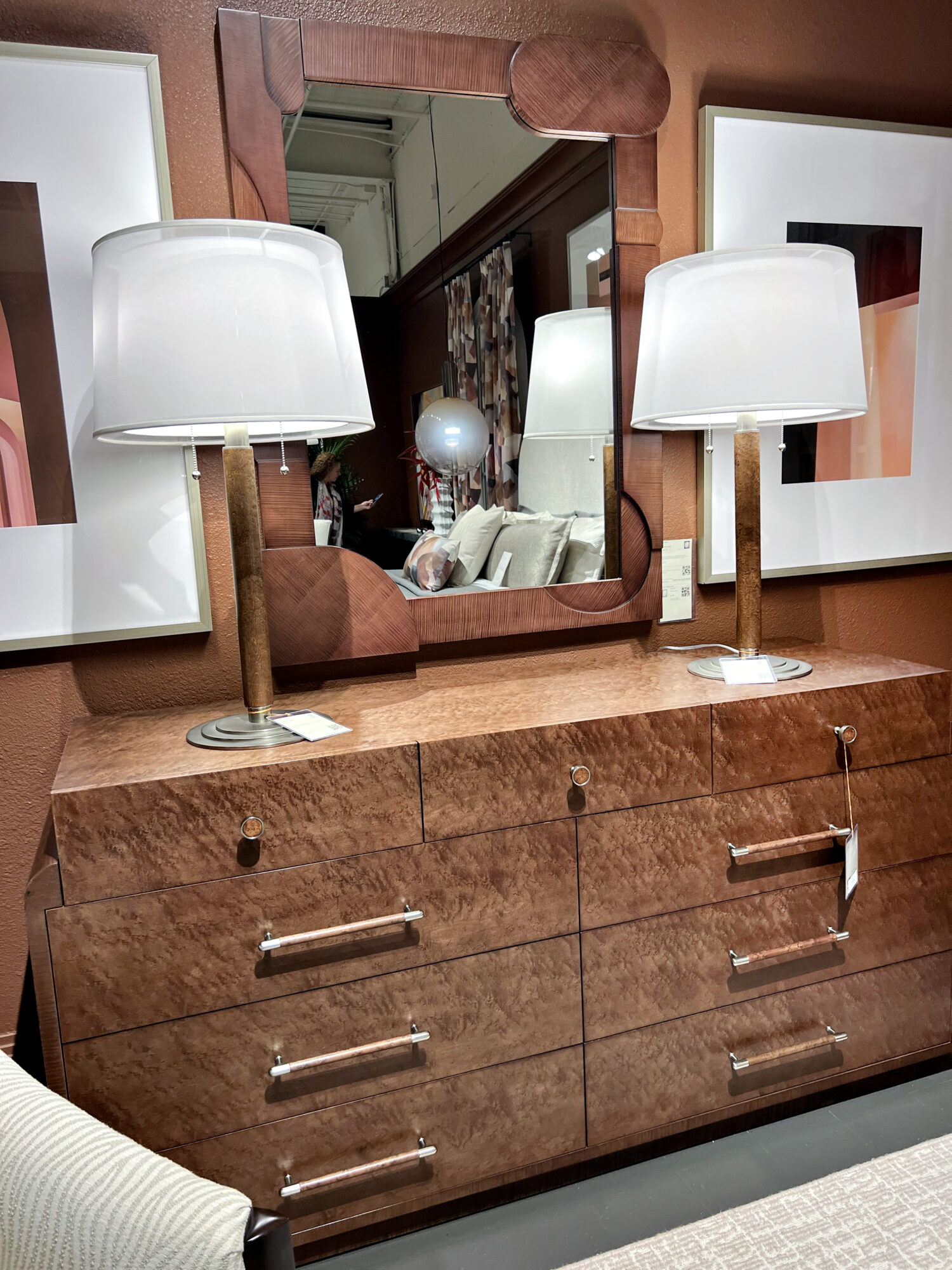 brown dresser with built in mirror and two matching white lamps on top