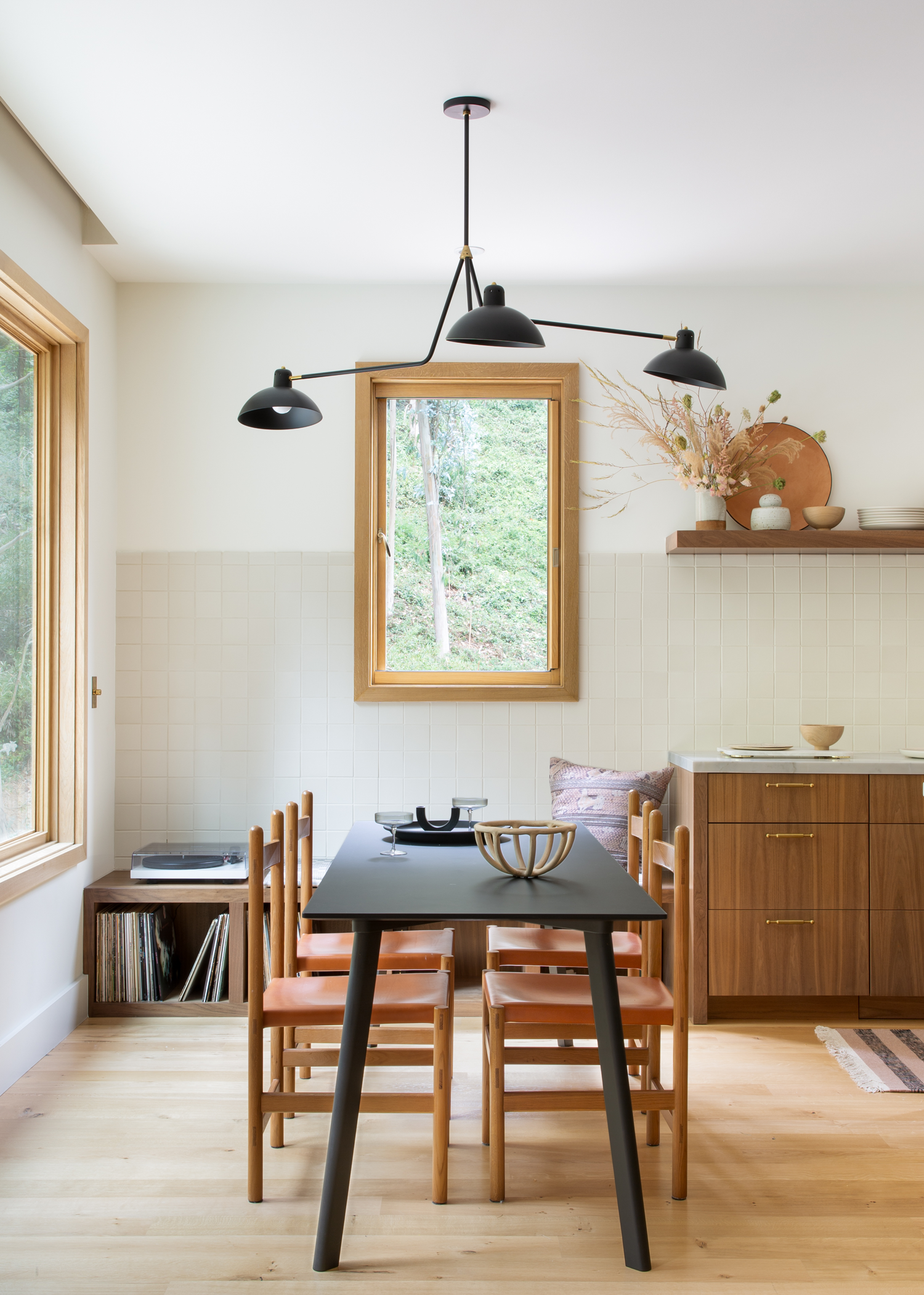 dining space with minimalist chairs, table and window