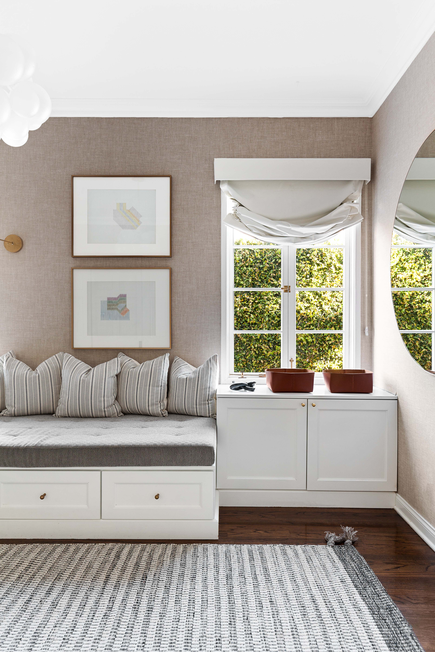 guest bedroom with daybed draped in earthy shades, part of 2024 paint color trends