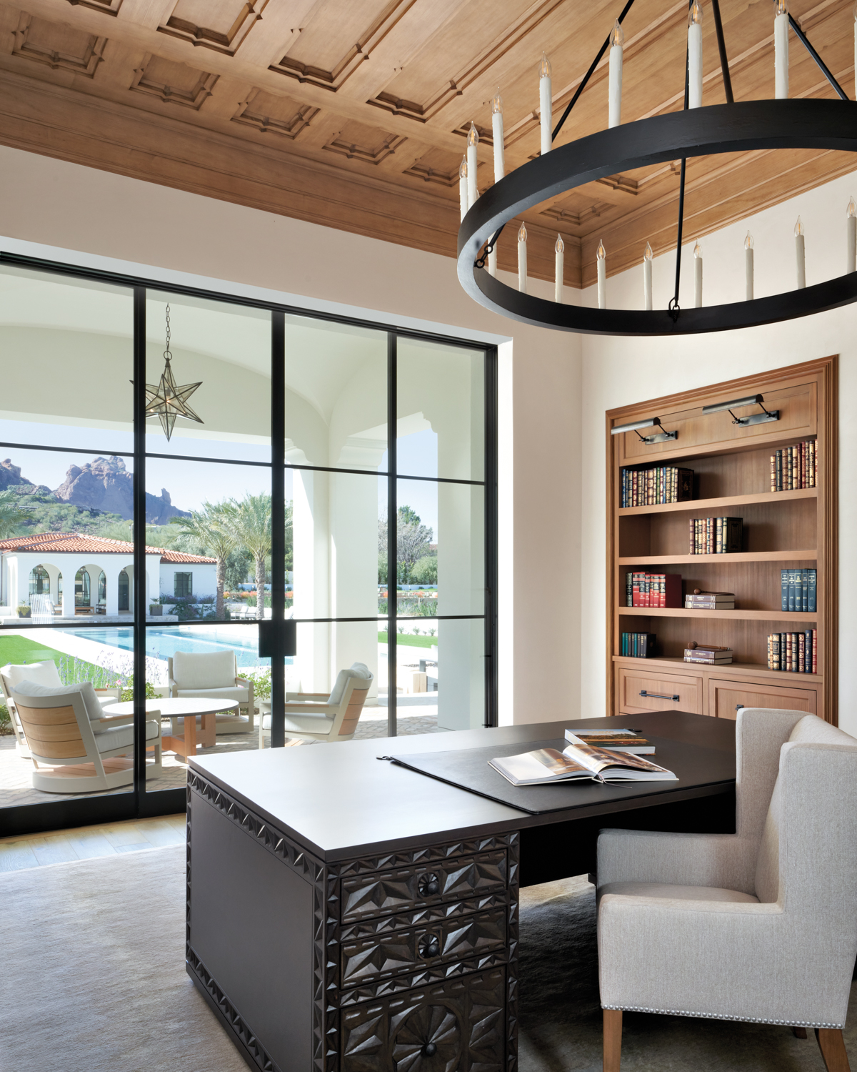 library with wood-paneled ceilings, built-in...