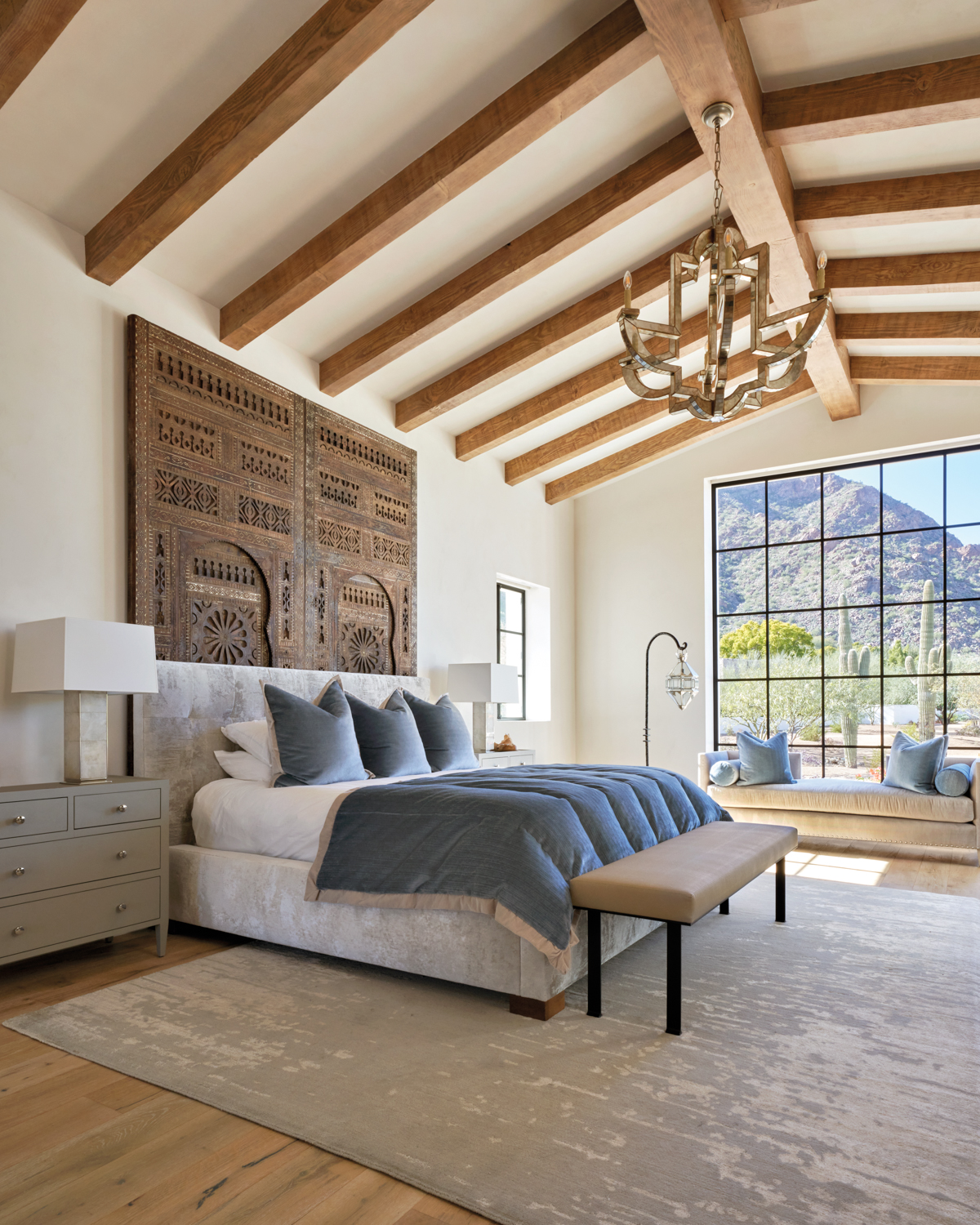 a wood-beamed bedroom with Moroccan...