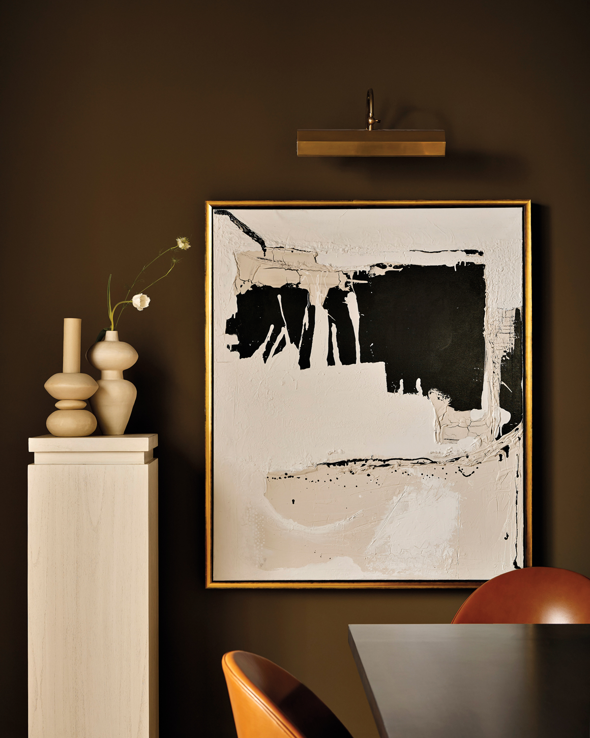 abstract framed artwork next to...