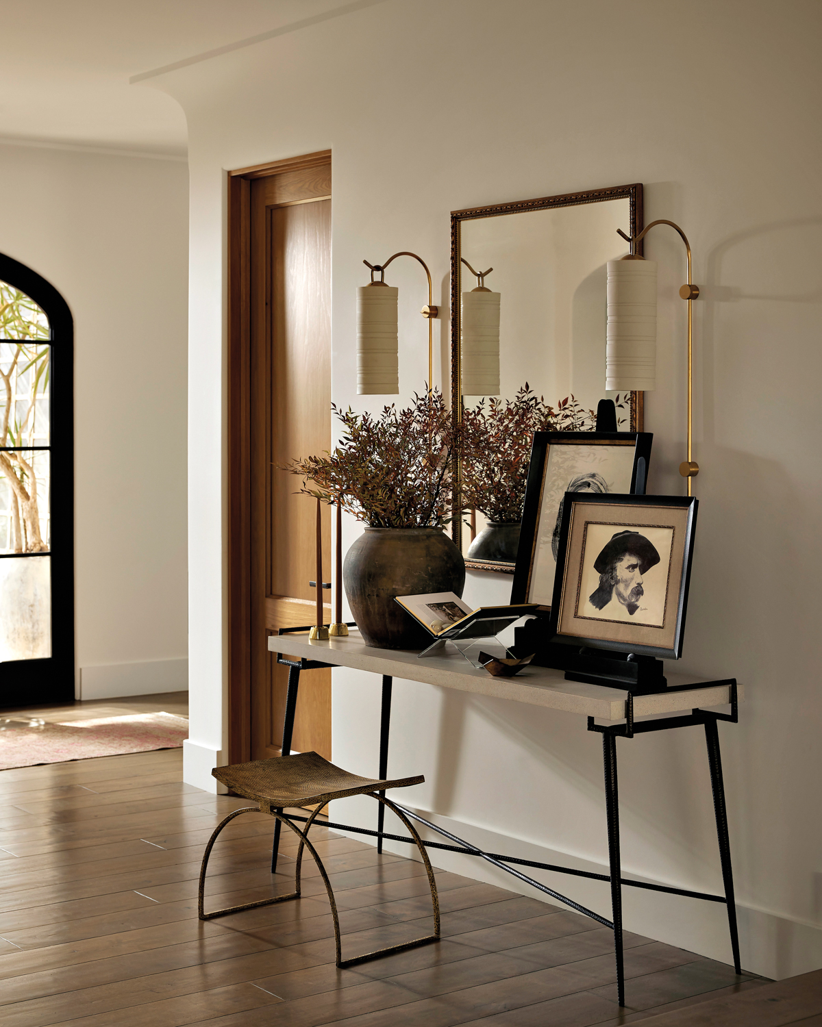 entry with a mirror, sconces,...