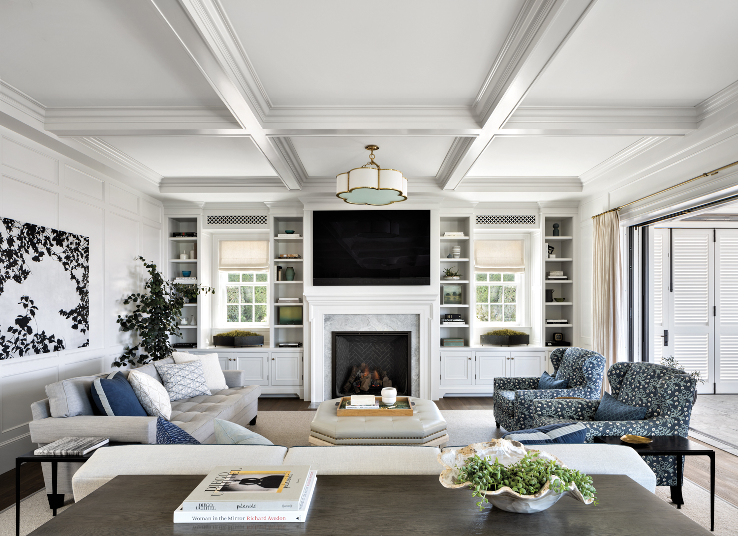 Living room with coffered ceilings...