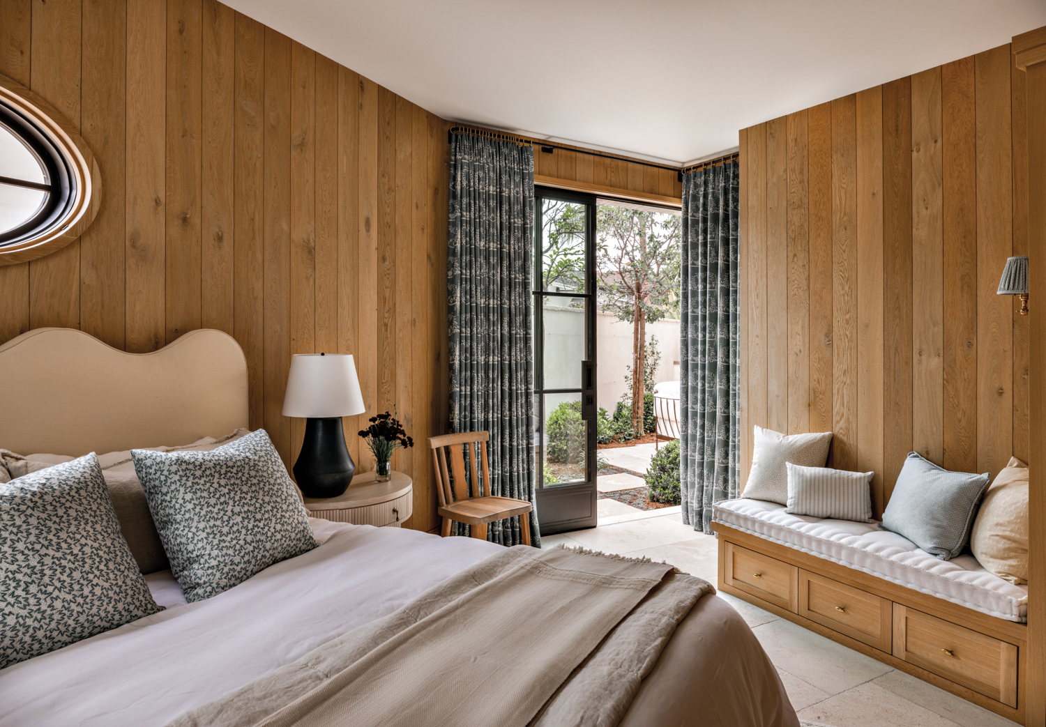 bedroom with oak paneled walls,...
