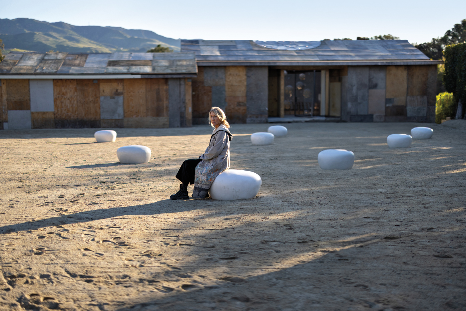 Artist Brigitte D’Annibale sitting in the middle of her art installation