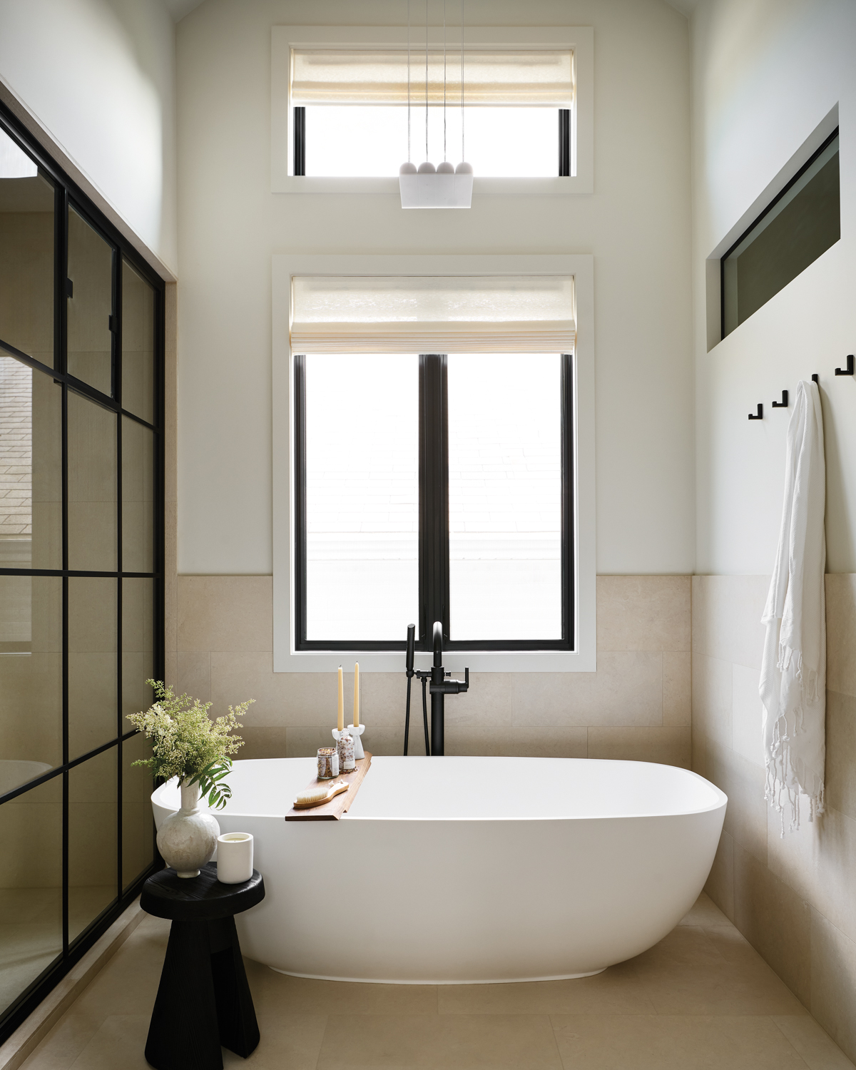Freestanding tub sits in a...
