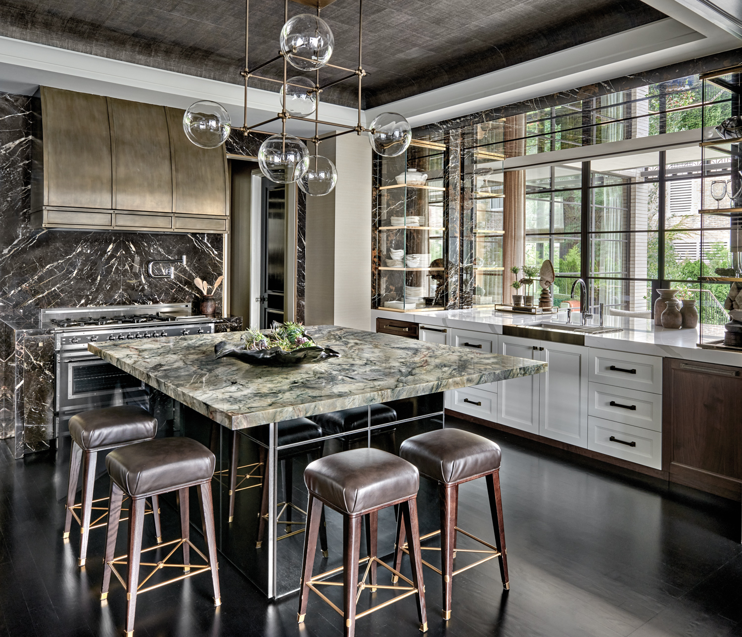 black marble kitchen with burnished...