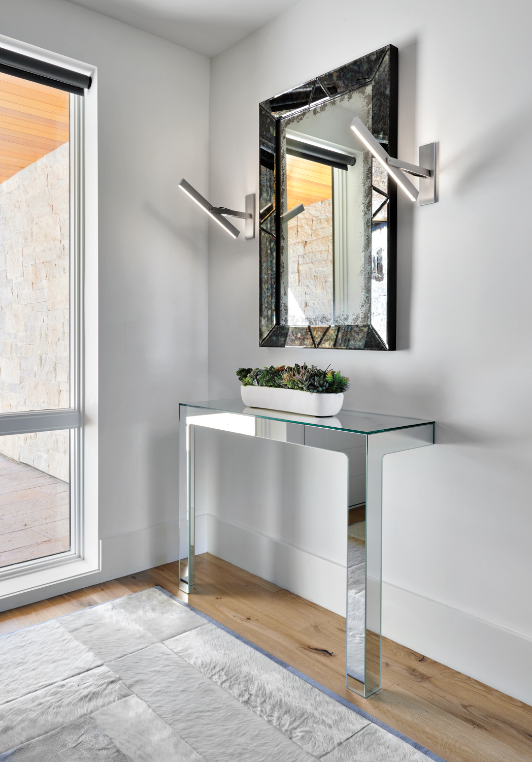 entry with mirrored console table...