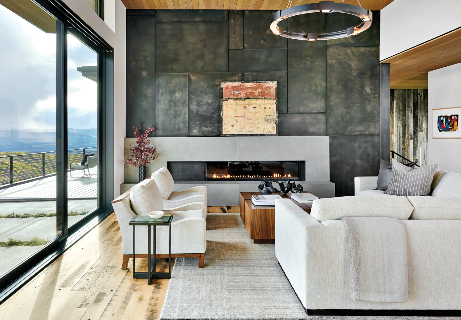 living room with concrete fireplace...