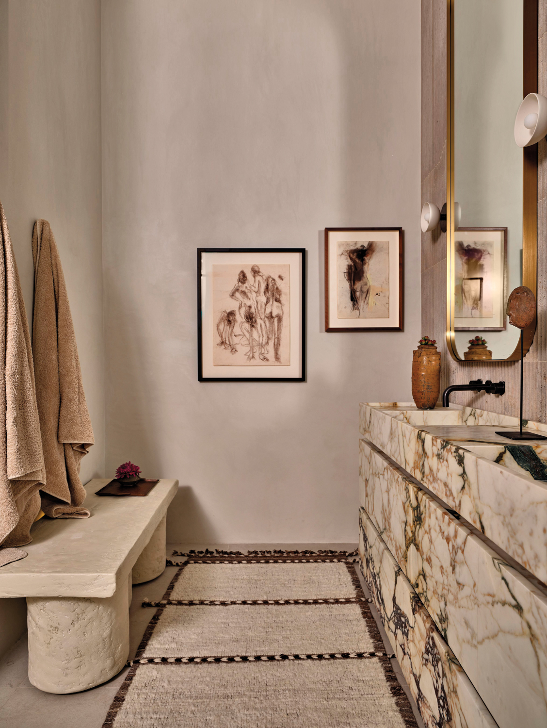 bathroom with plaster bench, Morrocan runner and vintage artwork
