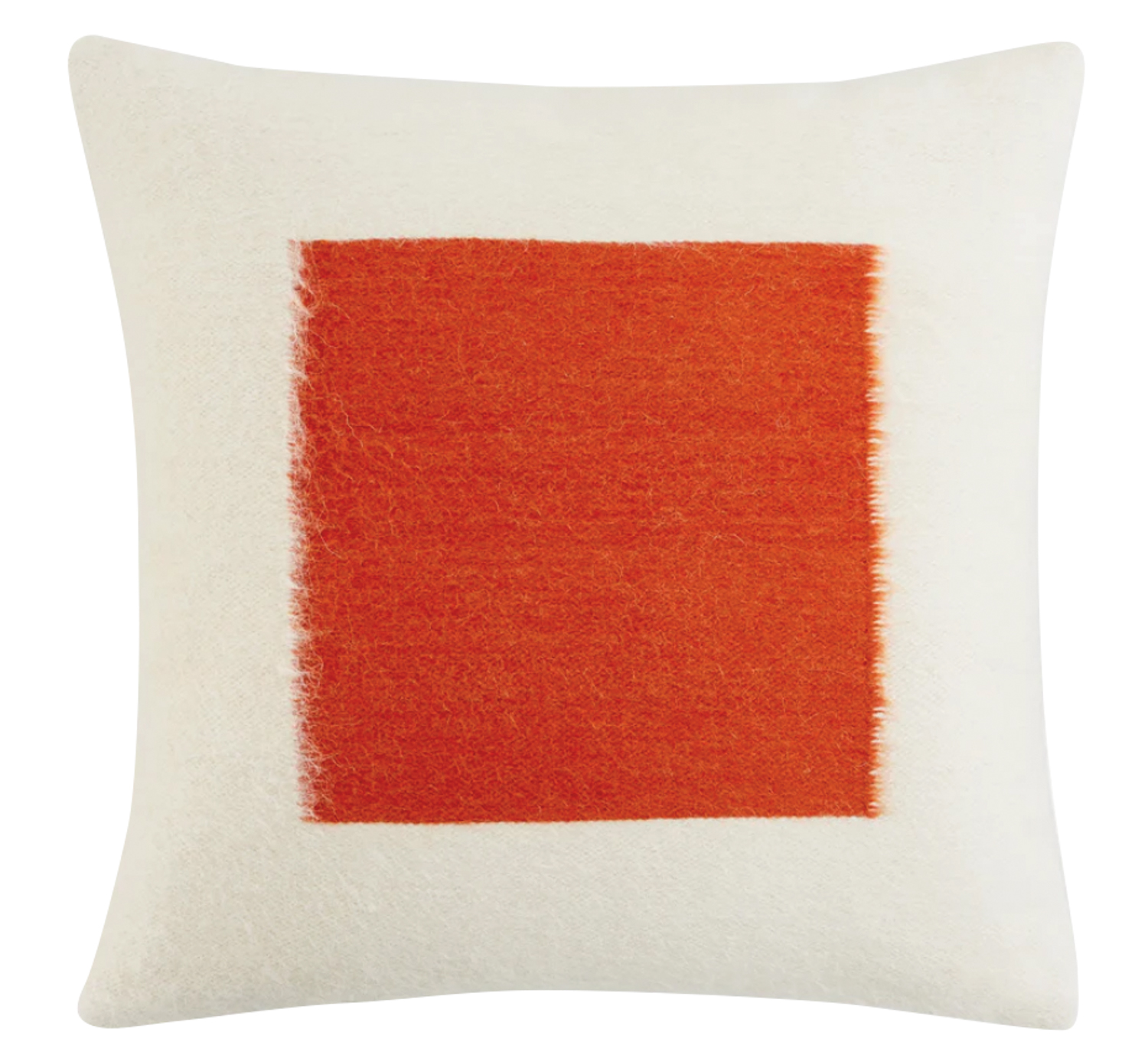 white pillow with red square