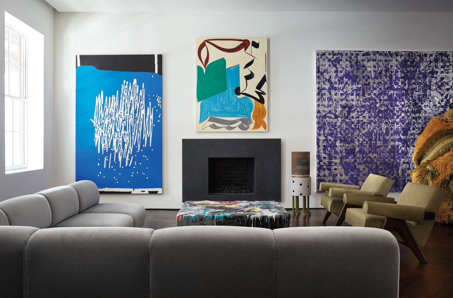 living room with colorful artwork on large tv