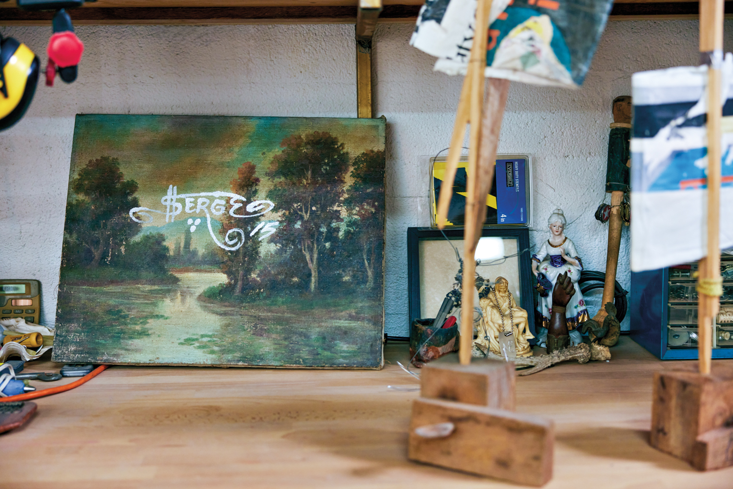 small figurines and artwork in michael loveland's studio