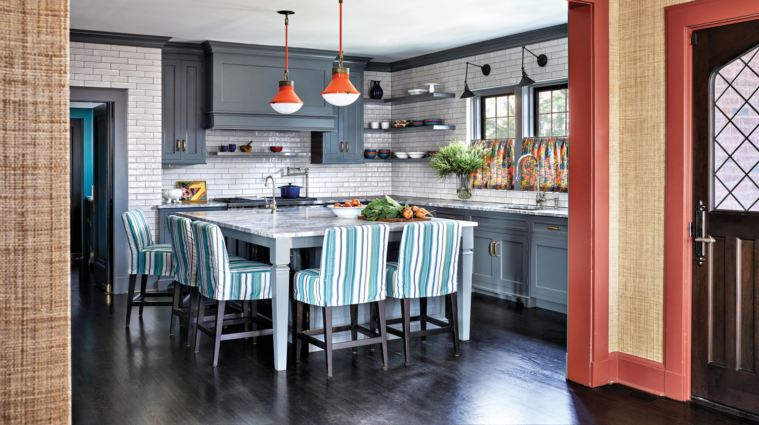 kitchen with striped chairs, orange...