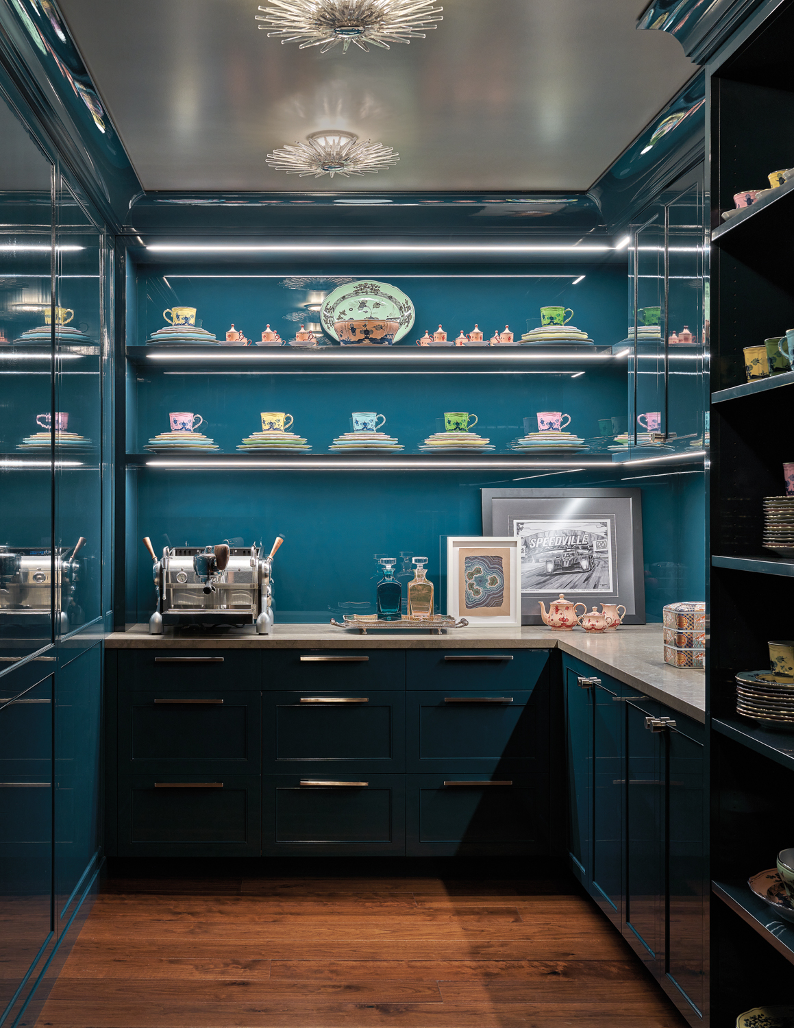 A pantry has vivid blue...