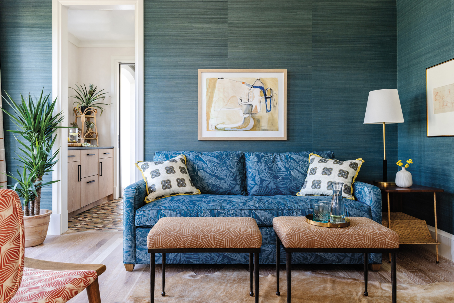 sitting room with teal wallcovering,...