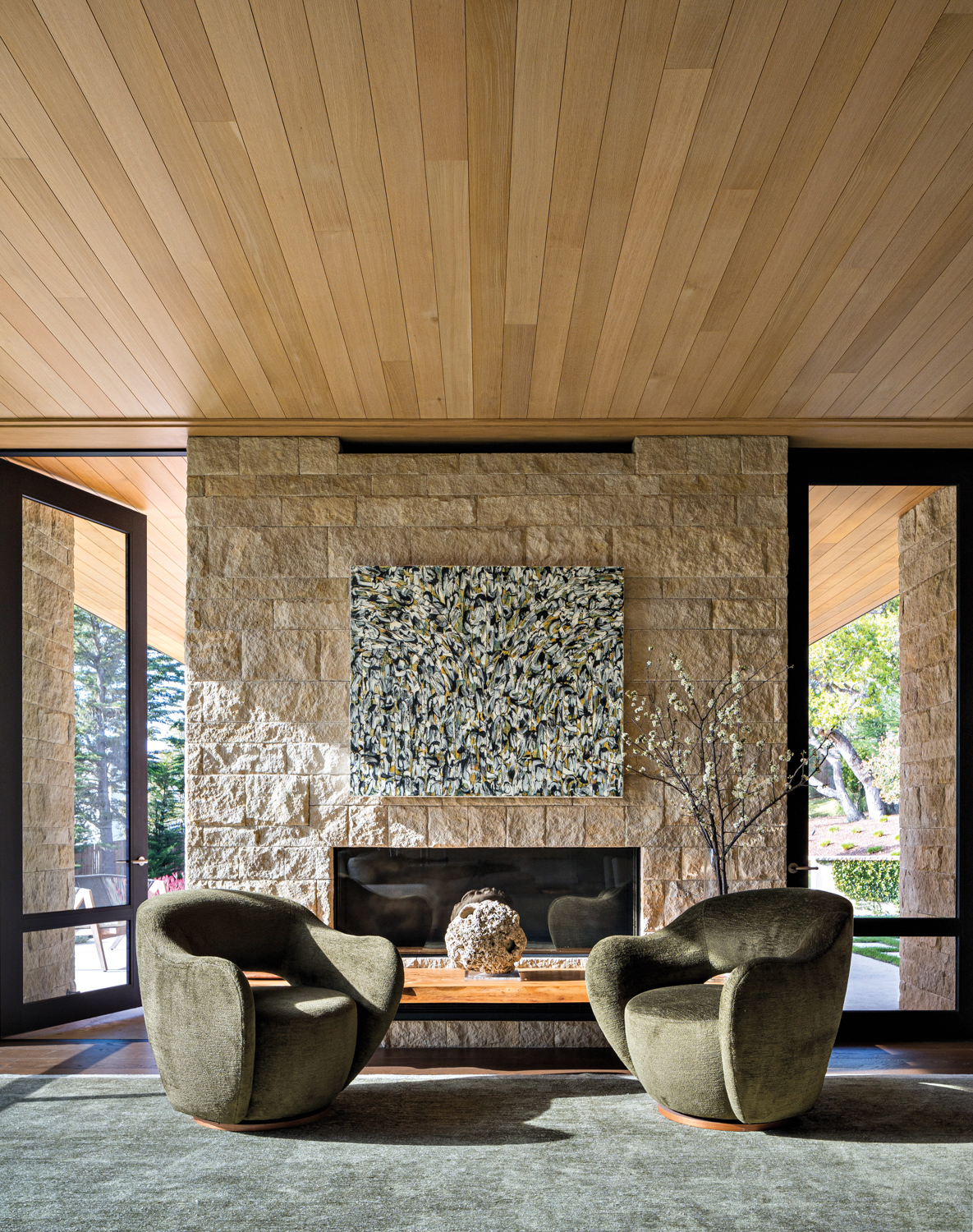 living room with large stone...