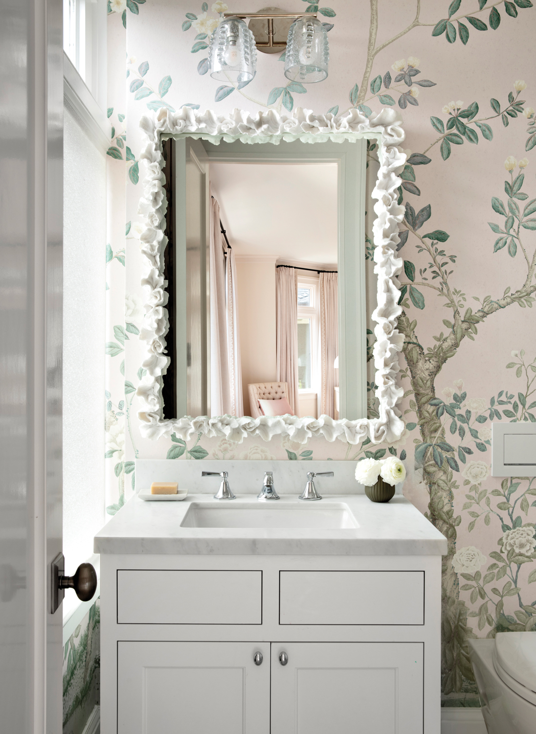 Powder room with floral wallpaper...