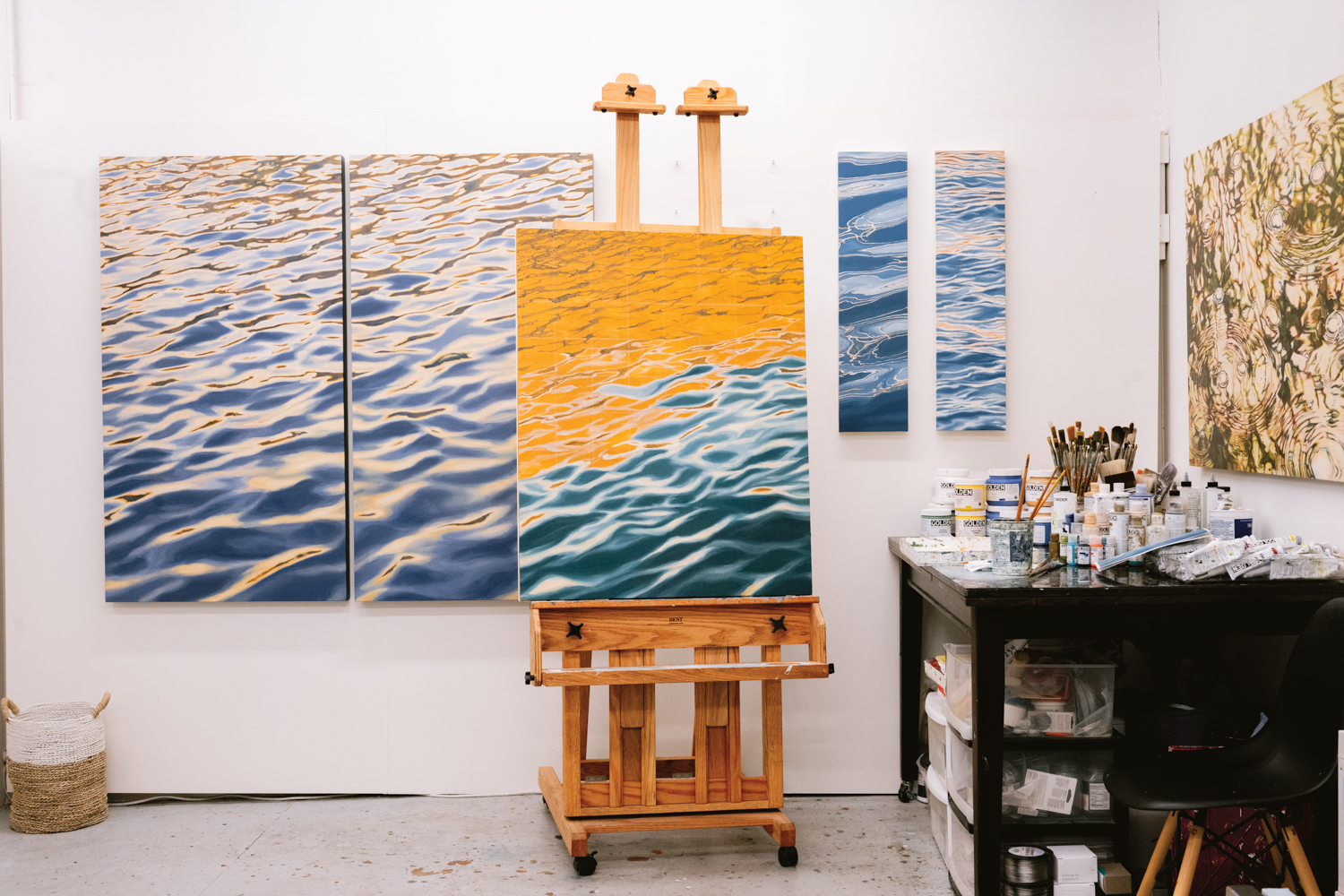 blue and yellow painting of the water's surface by Elizabeth Geisler