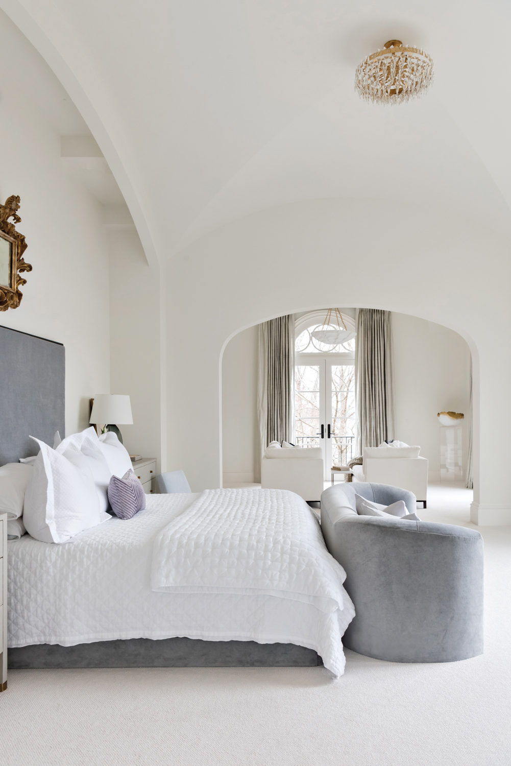 Serene bedroom with tall ceilings,...
