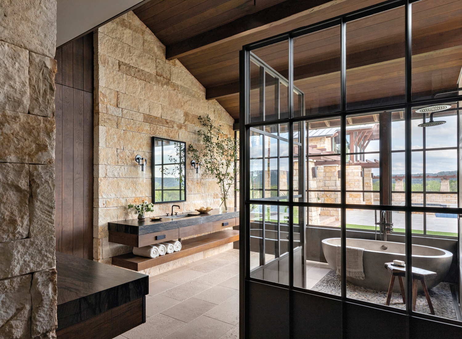 primary bathroom with stone walls...