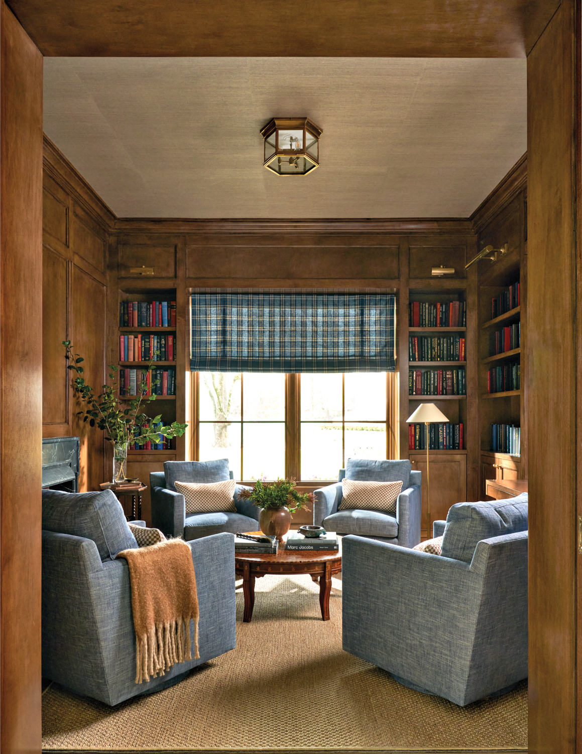 Brown paneled office and library...
