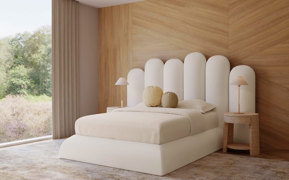 primary bedroom with white bedding and white headboard and circle pillows