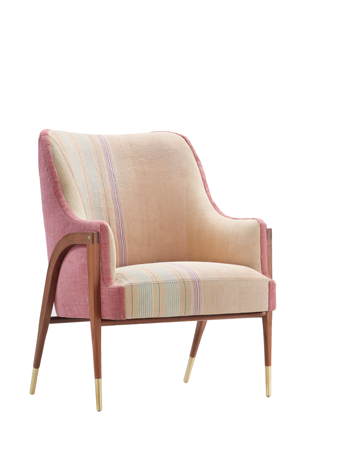Colorful repurposed vintage textile upholsters an armchair with slender wooden legs from new Aloka collection