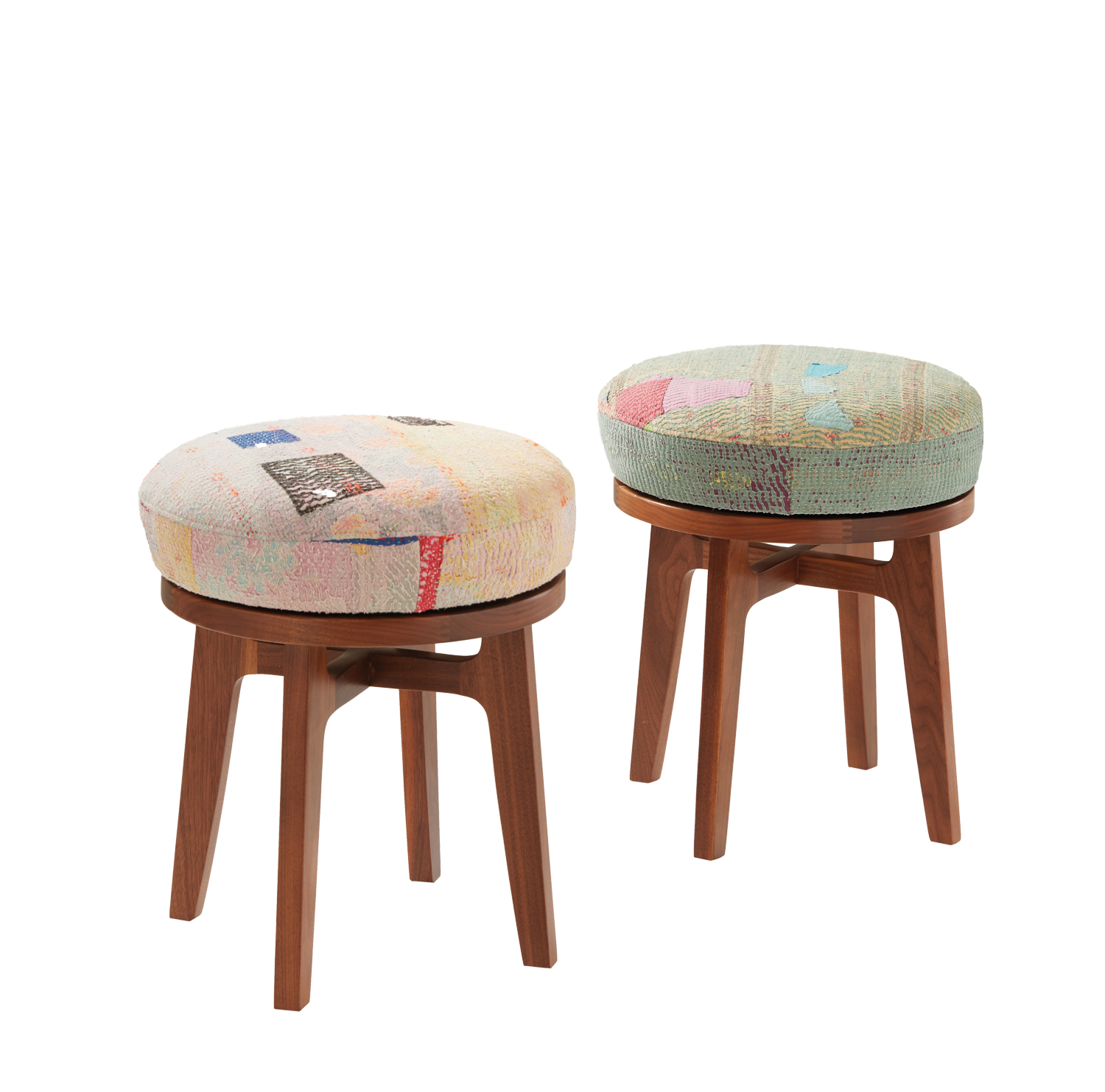 Colorful yet faded repurposed vintage textiles upholster stools with dark wooden bases from Aloka collection