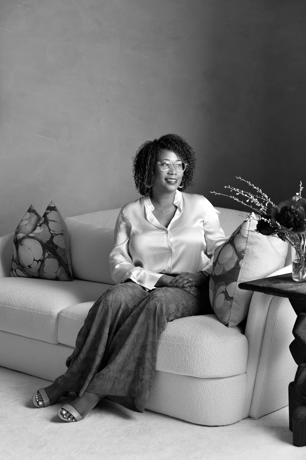 Letecia Ellis Haywood sits on a couch