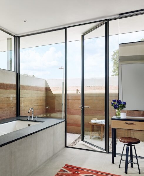 Bathroom with glass sliding door wall.