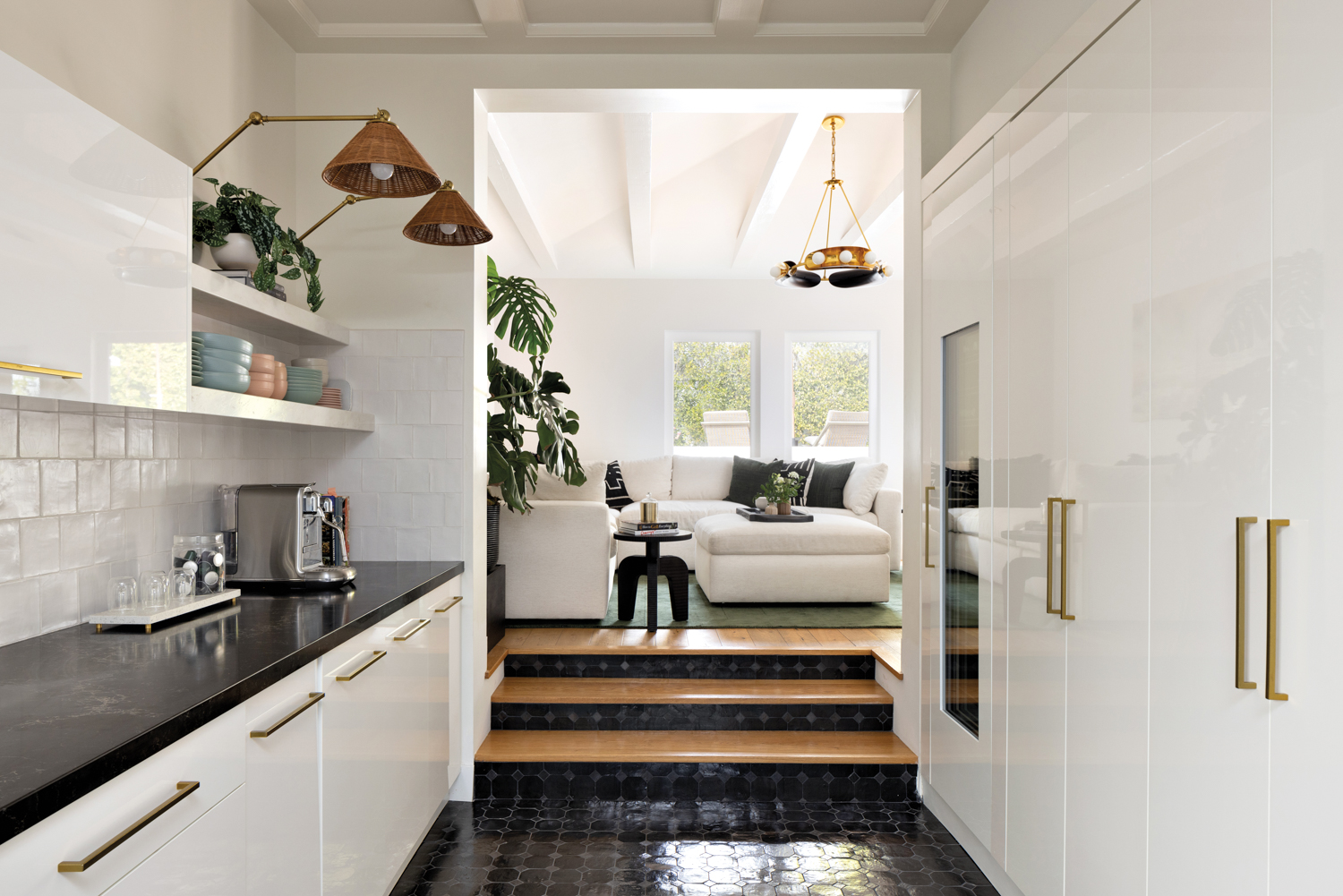 Kitchen with black tile floors...