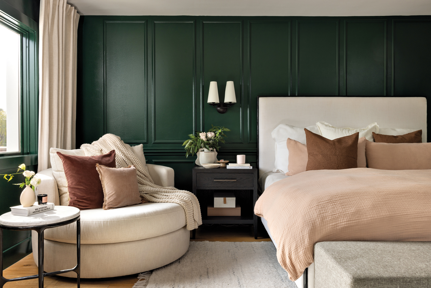 Green bedroom with oversized swivel...