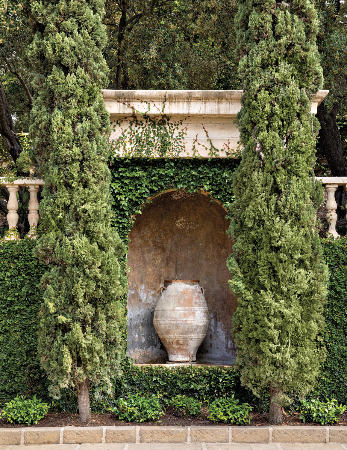 Vine-covered outdoor alcove of a...