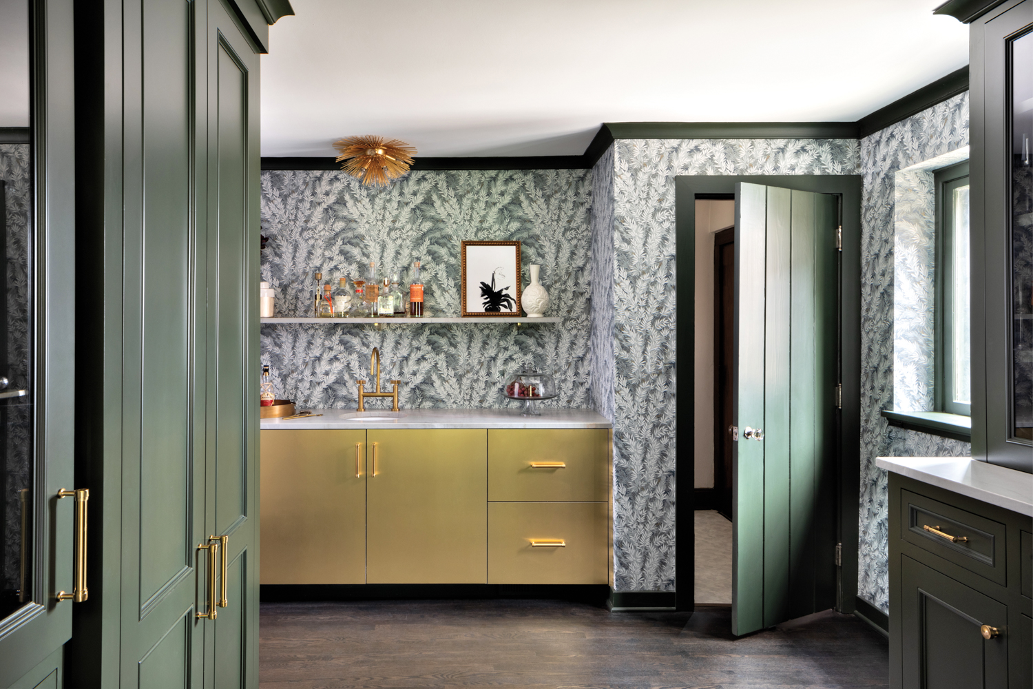 Pantry with green floral wallcovering,...