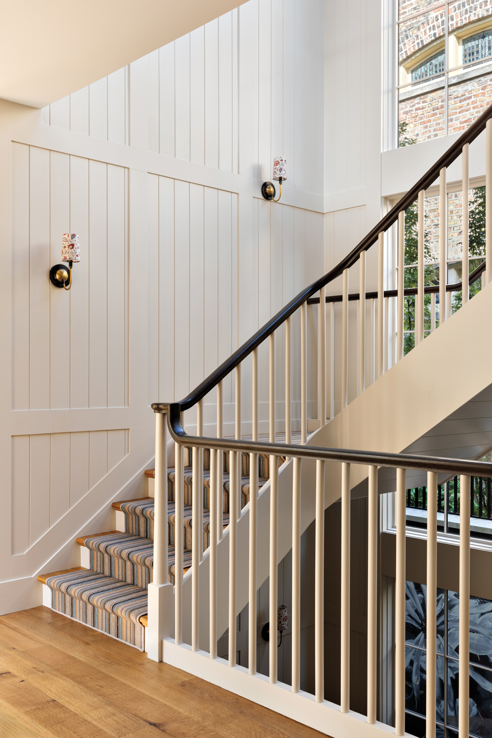 A stairwell with white shiplap...
