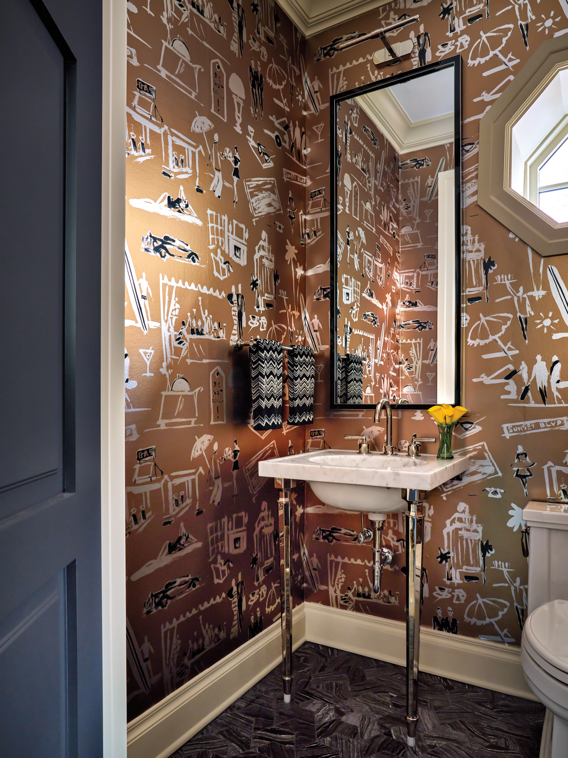 Powder room with brown-black-and-white patterned...