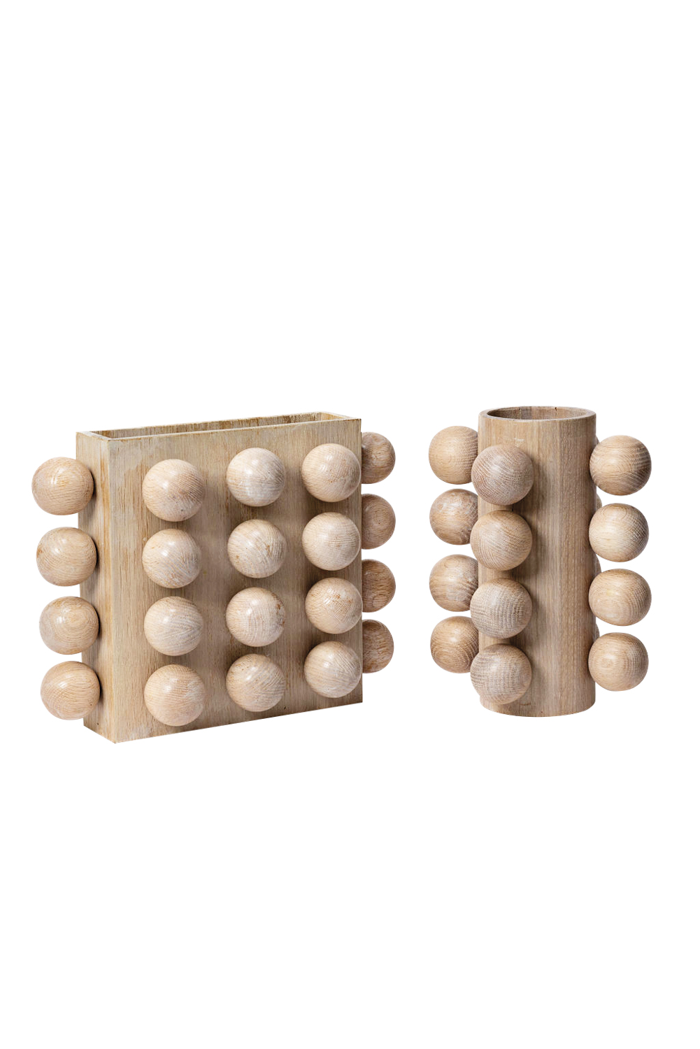 Rectangular and cylindrical wood vases decorated with wooden spheres.