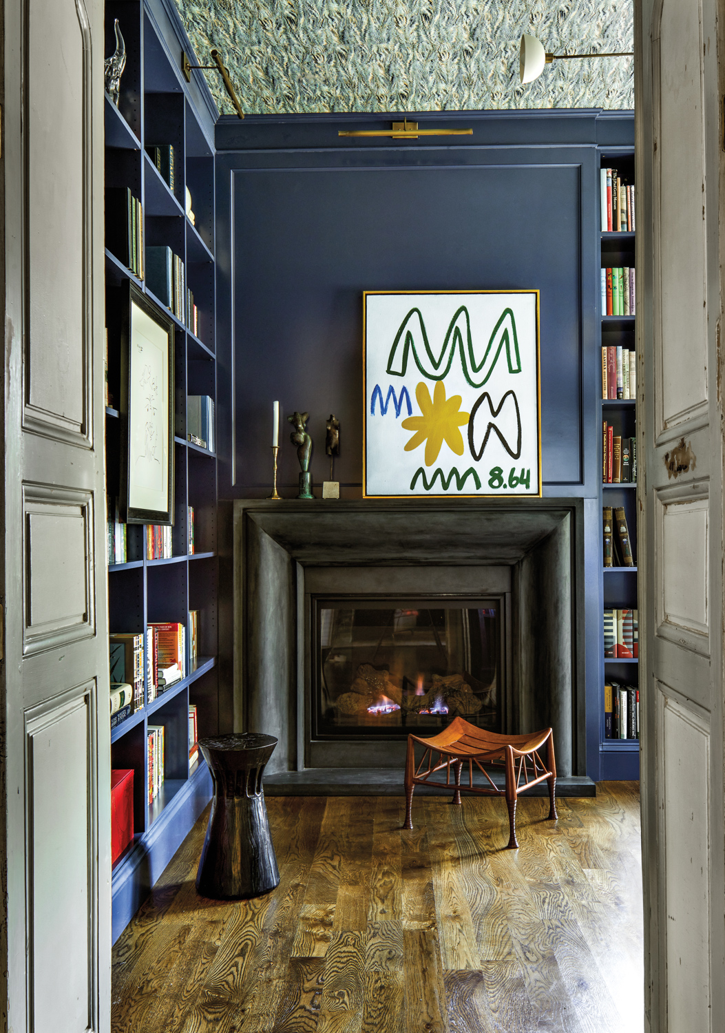 Home library fireplace vignette with...