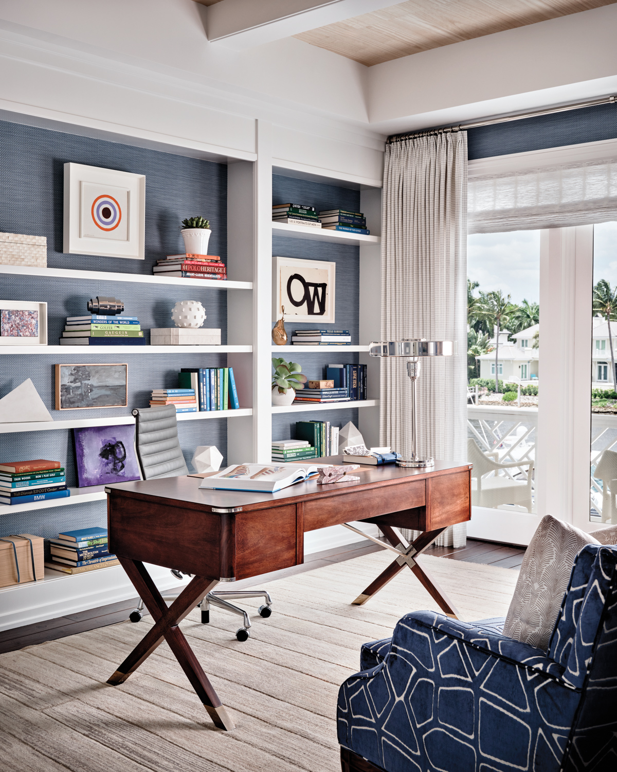 home office with blue wallpaper,...