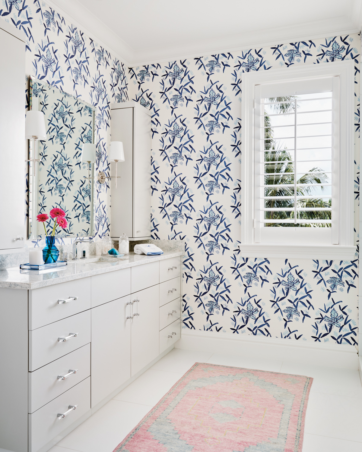 bathroom with blue floral-print wallcovering,...