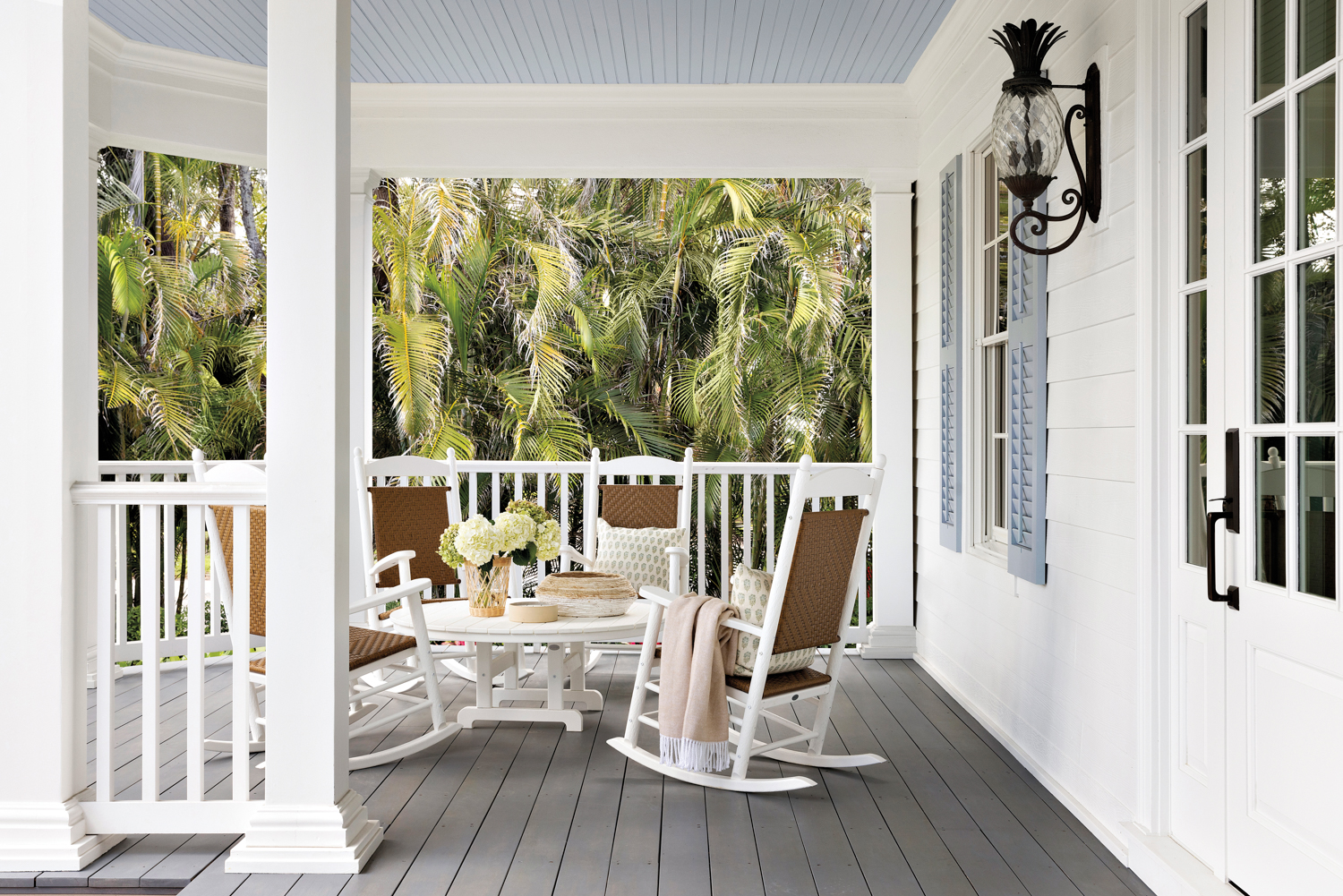 Front porch with white walls,...