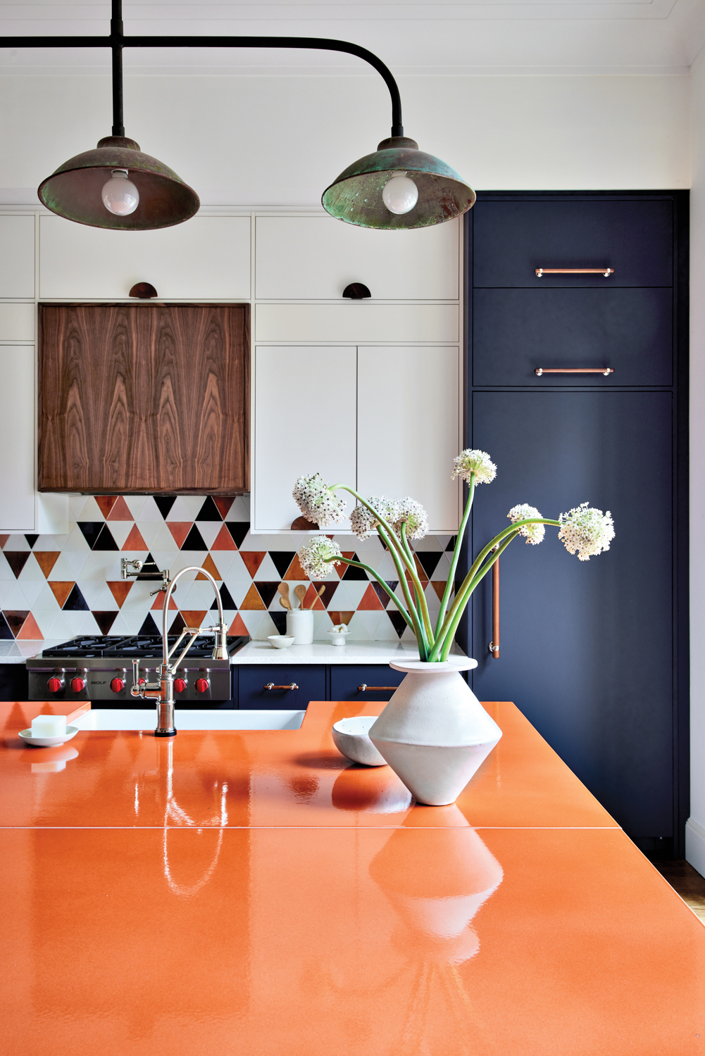 a kitchen with an orange...