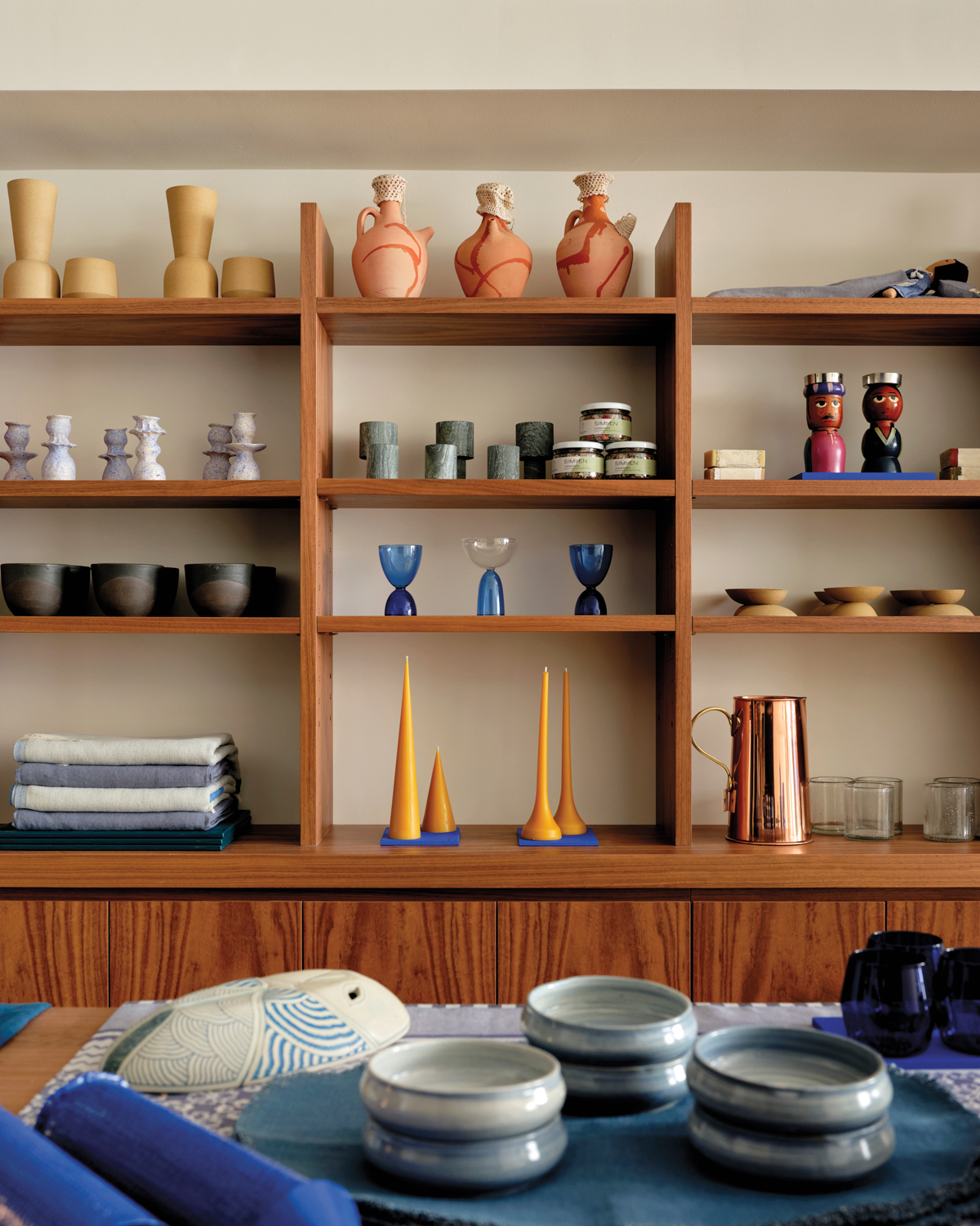 Vases and home decor items on display on shelving at Komal Kehar's Common Things shop